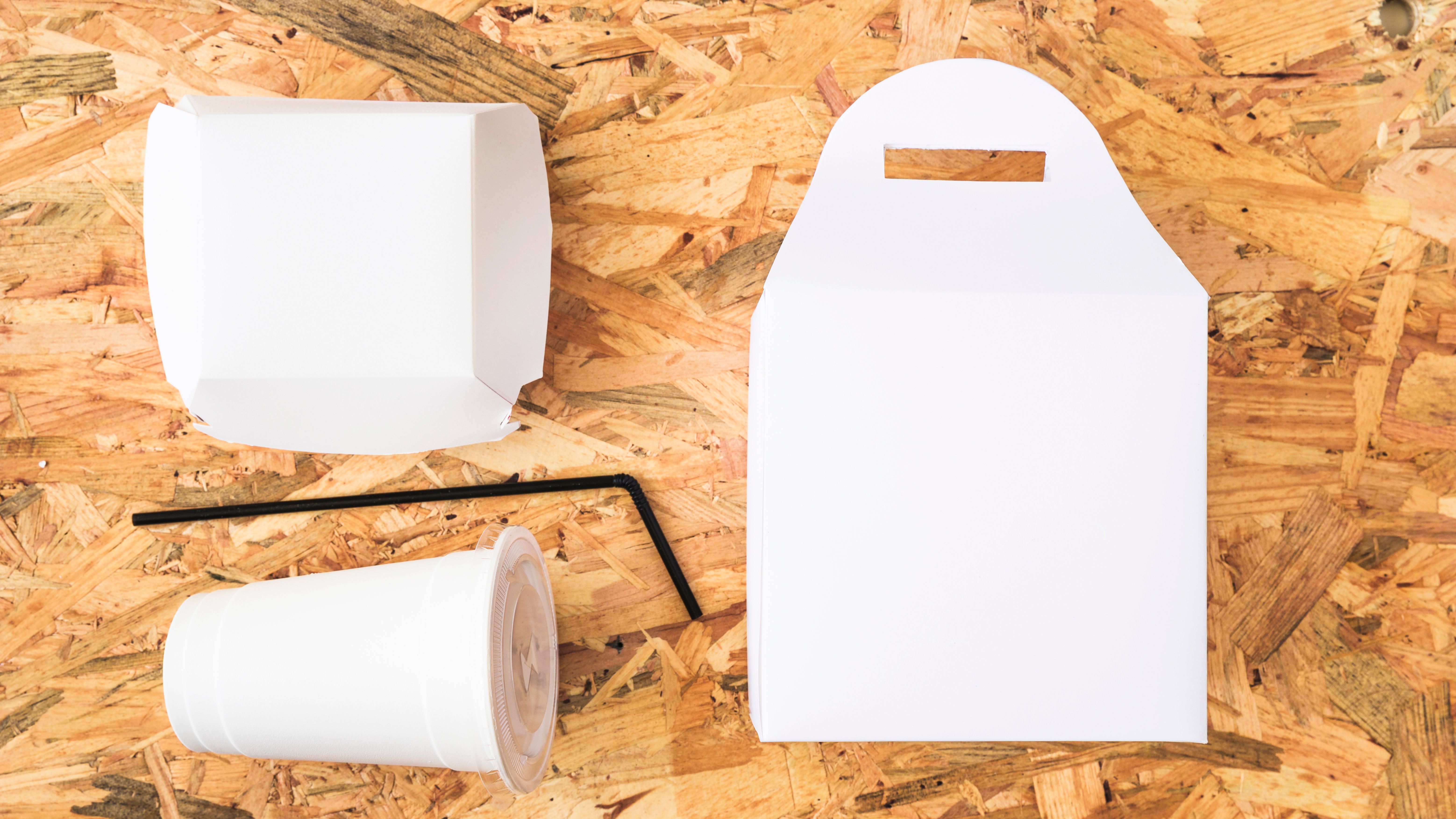 elevated-view-white-takeaway-food-wooden-background.jpg